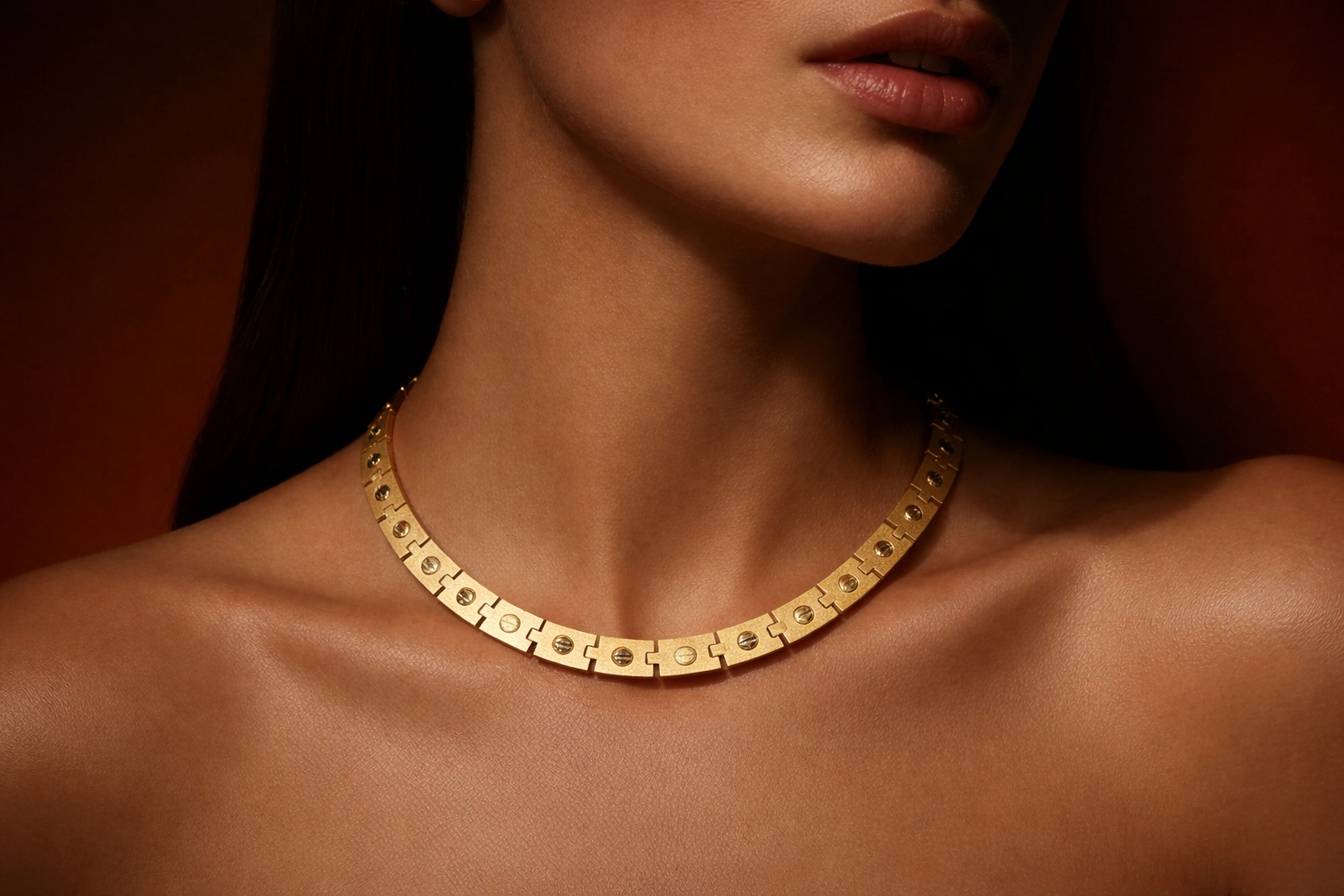 Close-up of a gold designer necklace with geometric links, luxury fine jewelry showcased by DJP Jewelers & Luxury Buyers, a Texas luxury marketplace for buying, selling, appraising, and servicing fine jewelry, luxury watches, precious metals, diamonds, designer bags, and bullion in Houston, The Woodlands, Sugar Land, and Austin.