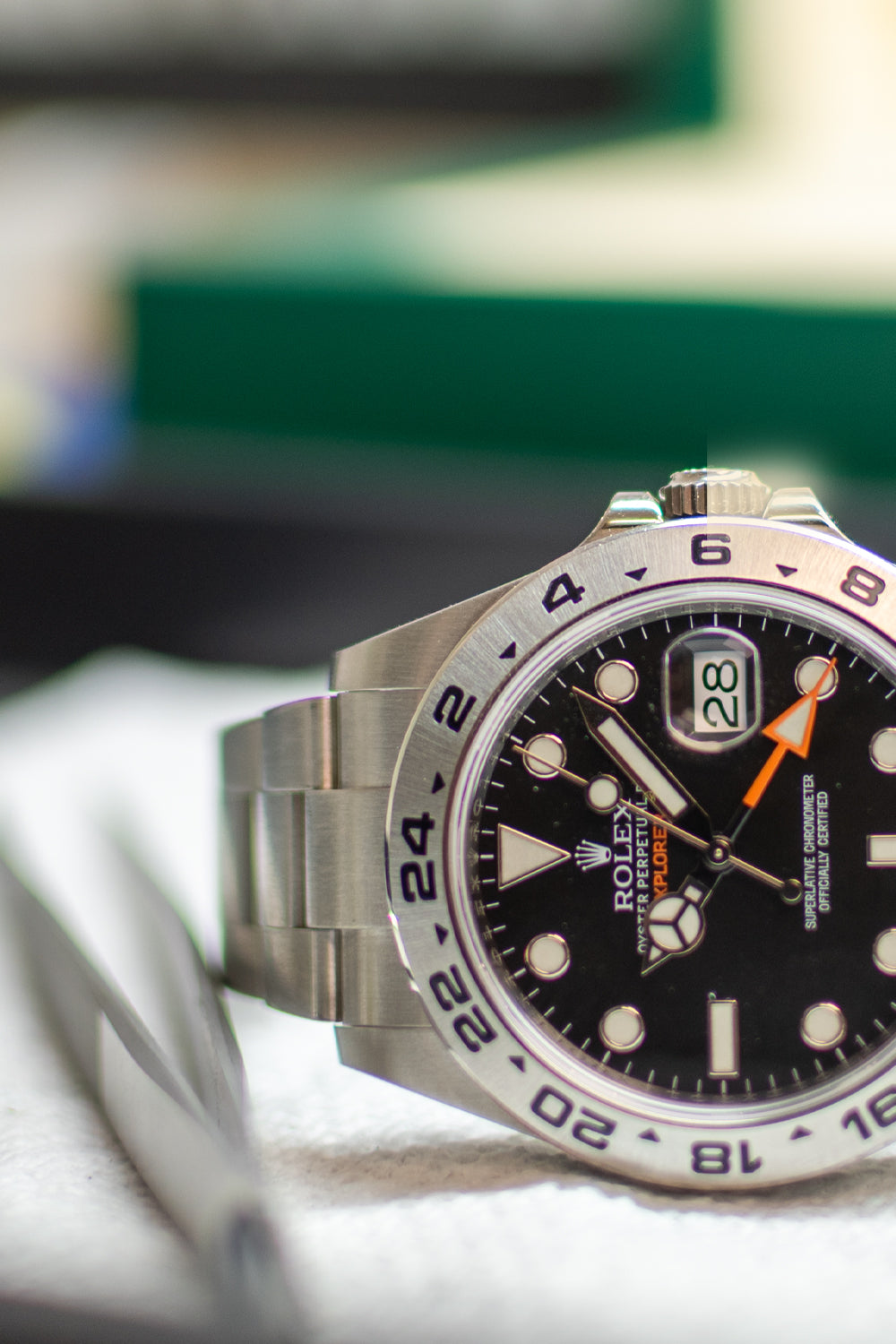 Rolex watch with black dial and silver case on a blurred background-watch service & Repair at DJP Jewelers & Luxury Buyers across Texas: Houston, The Woodlands/ Spring, Sugar Land and Austin