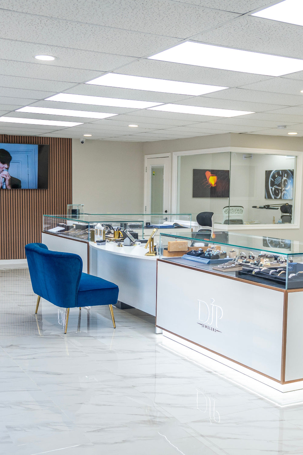 Modern DJP in The Woodlands / Spring store interior with white showcases with Jewelry and luxury watches- DJP Jewelers & Luxury Buyers- The Woodlands / Spring